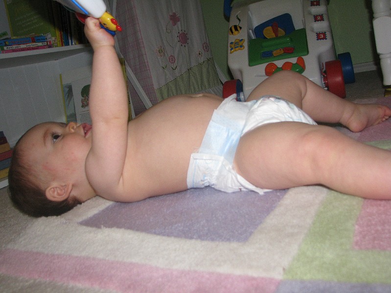 IMG_2220.JPG - Just chillin' with my baby Einstein toy. Dooo do deee do dee.