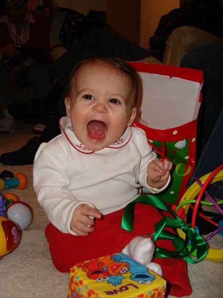 ChristmasCrazySmile2.jpg - Ha! Aunt Teri got me some Sesame Street blocks.