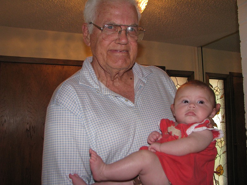 MeAndMrPoo.JPG - Mr. Poo holds me waaaay up high. He's about 6'5"!! I'll be that tall one day.