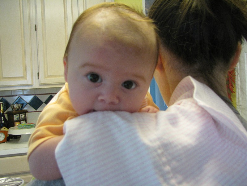 AllieMommyShoulder.JPG - Eating my burp cloth.
